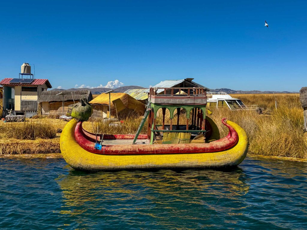 Lake Titicaca and traditional boat made of totora reeds.