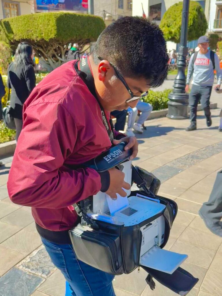 A local photographer with his portable printer.